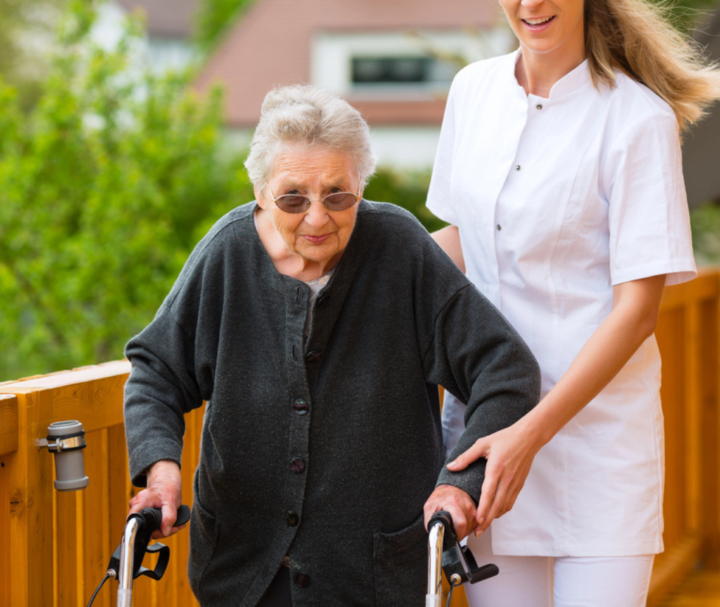 Nurse assisting senior woman with digital tablet